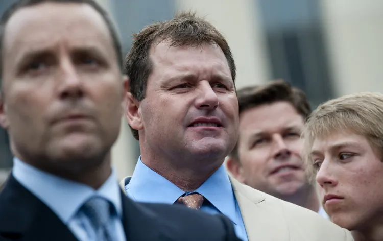 Former Major League Baseball pitcher Roger Clemens (2nd L) waits to speak to the media alongside attorney Michael Attanasio (L) after he was found not guilty on all charges in his perjury trial at US District Court in Washington on June 18. (SAUL LOEB/AFP/GettyImages)