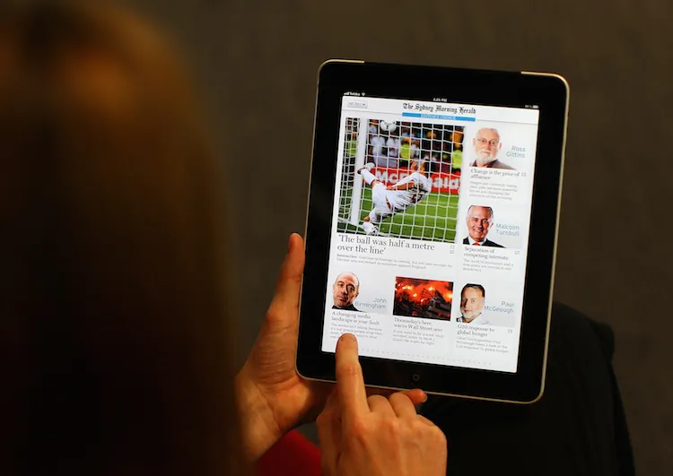 Picture of iPad user reading The Sydney Morning Herald on June 20, 2012 in Sydney, Australia. (Cameron Spencer/Getty Images)