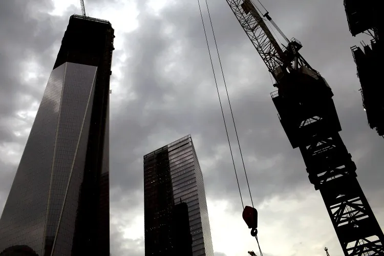 One World Trade Center (left) is viewed from Three World Tade Center on June 25, in New York City. A ceremony was held at Four World Trade Center as the last steel beam was hoisted 977 feet to the top of the building. The trapezoidal glass and steel office building, which is designed as an architectural backdrop to the September 11 Memorial, is scheduled to open in 2013. (Spencer Platt/Getty Images)