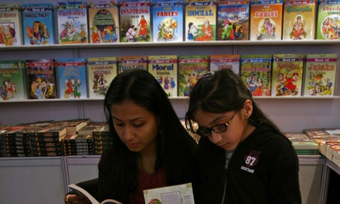 A mother and daughter browse through books on display in this file photo. Efforts are underway in the District of Columbia to help minority children learn to read and to help reading become a habit. (Maral Deghati/AFP/GettyImages)