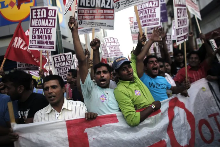 Immigrants take part in a demonstration against fascism in Athens on July 5, 2012. ( Angelos Tzortzinis/AFP/GettyImages)