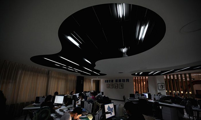 The designers work at the design center of Babei Group Co., Ltd on July 3, 2012 in Shengzhou, Zhejiang Province, China. China’s third richest region after Beijing and Shanghai, Zhejiang is now floundering due to a serious credit crisis. (Feng Li/Getty Images)