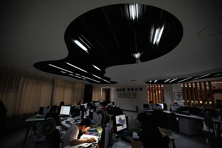 The designers work at the design center of Babei Group Co., Ltd on July 3, 2012 in Shengzhou, Zhejiang Province, China. China’s third richest region after Beijing and Shanghai, Zhejiang is now floundering due to a serious credit crisis. (Feng Li/Getty Images)