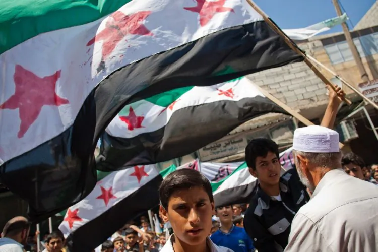 Thousands of Syrians from Mareh, a city in the northern countryside of Syria, protest against the massacre in Treimsa, in Hama province, on July 13, 2012. (Vedat Xhymshiti/AFP/GettyImages)