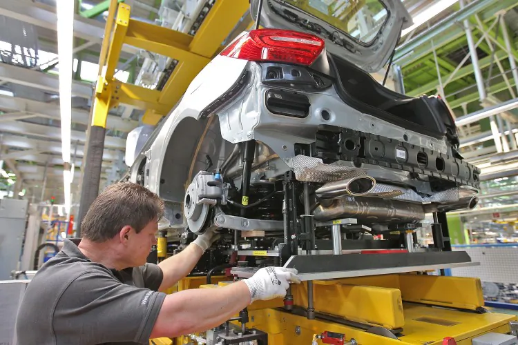 An employee works on the new A-Class Mercedes-Benz passenger car at the Mercedes-Benz factory in Rastatt, Germany, on July 16. German industrial production figures came in below expectations last week, adding further doubt to the current health of the eurozone economy. (Thomas Niedermueller/Getty Images)