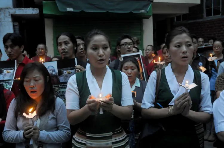 Exiled Tibetans participate in a candle light vigil on July 17, 2012. China’s crackdown on Tibetans escalated this week in Sichuan Province after three more self-immolations were reported. (Lobsang Wangyal/AFP/GettyImages)