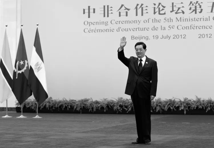 Chinese Communist Party head Hu Jintao waves, standing in the Great Hall of the People July 19 in Beijing, China. Hu is rumored to be giving up all of his Party posts at the 18th Party Congress this October. (Andy Wong/Getty Images)