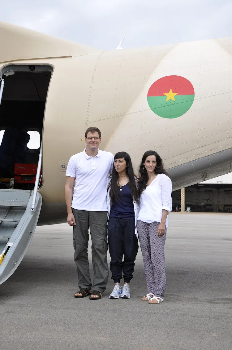 (L-R) Spain's Enric Gonyalons and Ainhoa Fernandez Rincon and Italy's Rossella Urru pose upon their arrival in Ouagadogou on July 19, 2012. Three European aid workers released in Mali after being kidnapped by an Al-Qaeda-linked jihadist group were today "safe and sound" in neighbouring Burkina Faso, a negotiator said. (Ahmed Ouoba//AFP/Getty Images)