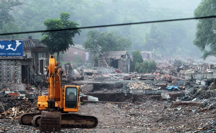 This photo taken on July 26, 2012, shows the damaged homes in the worst-hit area of Fangshan, on Beijing's mountainous southwestern outskirts. Distraught residents reported cars being swept away and said many people were still missing. (STR/AFP/Getty Images)