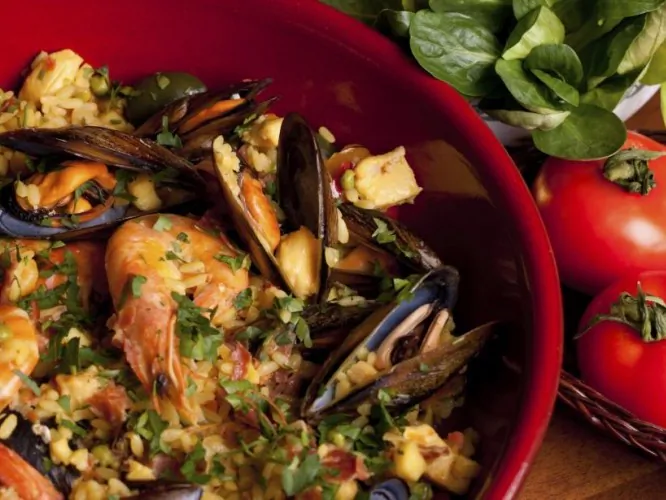 Paella is a Spanish dish that utilizes medium grain rice in a very creative way. Not dull at all, the dish can be made with just about any ingredient that goes with rice. (Corina Daniela Obertas/Photos.com)