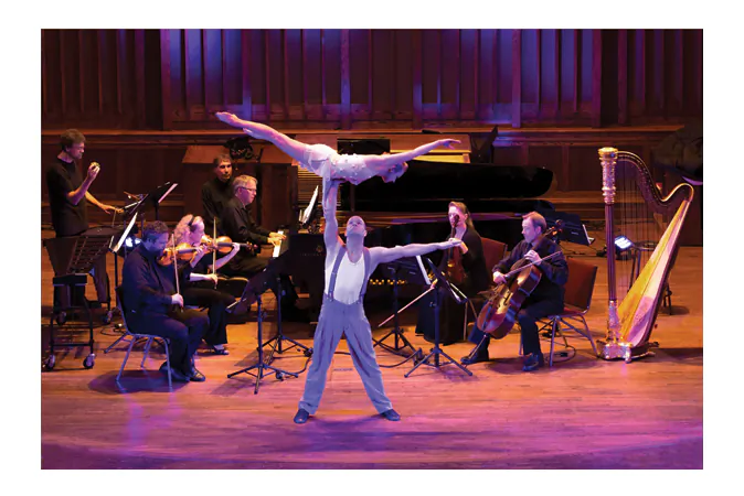 Members of Cirque Fantastic perform with musicians from Music and Beyond during the opening gala of the Music and Beyond festival in Ottawa on July 4, 2013. (Ashley Murfin)