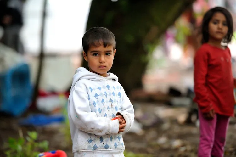 Children from Roma community are pictured as riot police evacuate their camp, on August 9, 2012 in Villeneuve d'Ascq, northern France. (Philippe Huguen/AFP/Getty Images)