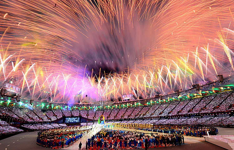 The Olympic Flag is handed from Mayor of London, Boris Johnson to IOC President Jacques Rogge, who passes to Mayor of Rio de Janeiro, Eduardo Paes during the Closing Ceremony of the London 2012 Olympic Games. (Jeff J Mitchell/Getty Images)