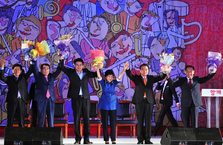 Park Geun-Hye (C) reacts after being elected as a presidential candidate during a national convention of the New Frontier Party for a presidential primary in Goyang, north of Seoul, on August 20, 2012. (Jung Yeon-Je/AFP/Getty Images)