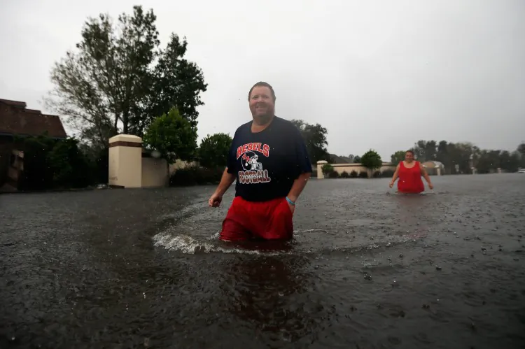 A man heads to check on his house through flood water that came on shore after Hurricane Isaac. More flooding is expected for southeastern Louisiana. (Chris Graythen/Getty Images)