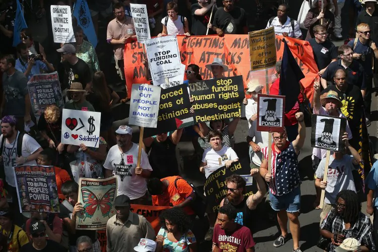 Protestors march through the business district before the start of this years Democratic National Convention (DNC). Groupings of tents also appeared overnight in Marshall Park in uptown Charlotte, and the Occupy protesters said that they would not leave. (Scott Olson/Getty Images)