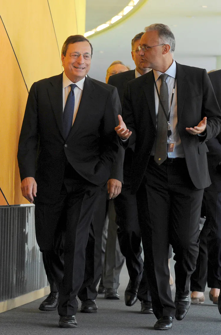 European Central Bank (ECB) chief Mario Draghi (L) arrives for a meeting with members of the Economic and Monetary Affairs Committee at EU headquarters in Brussels, Sept. 3. (John Thys/AFP/GettyImages)