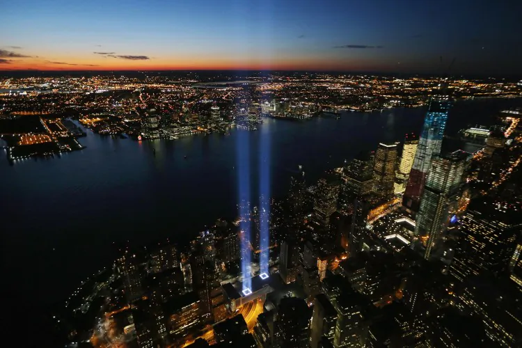 The ‘Tribute in Light’ shines as One World Trade Center (R) rises under construction on the eleventh anniversary of the terrorist attacks on lower Manhattan at the World Trade Center on September 11, 2012 in New York City. (Mario Tama/Getty Images)