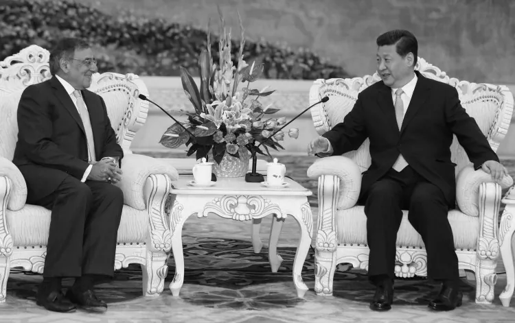 U.S. Secretary of Defense Leon Panetta sits with China's next communist leader Xi Jinping in Beijing on Sept. 19, 2012. It was Xi's first major public appearance in over two weeks, and came amidst claims that Hu Jintao, the current leader, would remain on the Party's military commission for some time after Xi assumes office as head of Party. (Larry Downing/Getty Images)