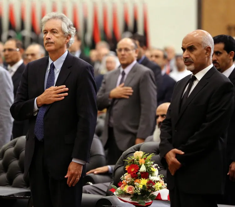 U.S. Deputy Secretary of State for Middle East Affairs William J. Burns (L) and Mohamed Yusuf Al Magariaf, president of Libya's ruling General National Congress (R), attend a ceremony to honour late U.S. ambassador J. Christopher Stevens, on Sept. 20, 2012, in Tripoli. (Mahmud Turkia/AFP/GettyImages)
