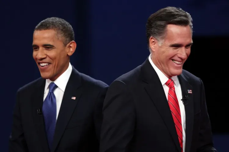 Democratic presidential candidate, President Barack Obama (L) walks away from Republican presidential candidate, former Massachusetts Gov. Mitt Romney (R), after the first presidential debate in Denver, Colo., Oct. 3. (Win McNamee/Getty Images)