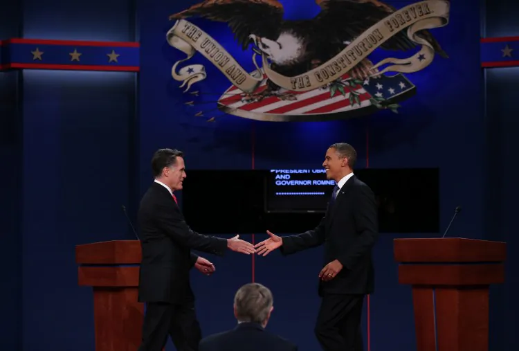 Democratic presidential candidate, U.S. President Barack Obama (R) shakes hands with Republican presidential candidate, former Massachusetts Gov. Mitt Romney (L) during the Presidential Debate at the University of Denver on October 3, 2012 in Denver, Colorado. The two candidates maneuvered around a sprawling heap of topics, but mainly focused on the economy—a key election provision, and one that has nagged Obama’s administration. (Win McNamee/Getty Images)