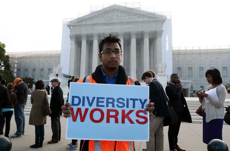 Travis Ballie holds a sign in front of the U.S. Supreme Court on Oct. 10, 2012, in Washington, during arguments for and against affirmative action in the case of Fisher v. University of Texas (UT) at Austin. (Mark Wilson/Getty Images)