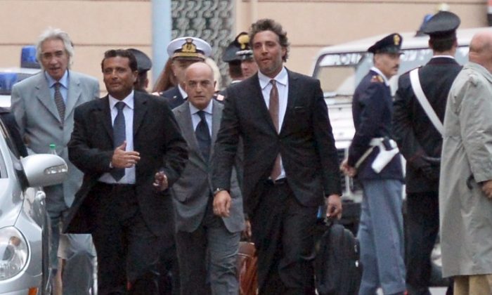 The captain (L) of the "Costa Concordia" Francesco Schettino leaves, after hearings at a Grosseto court, to work out the details of the tragic night of the "Costa Concordia" disaster on Oct. 15, 2012. (Alberto Pizzoli/AFP/Getty Images)