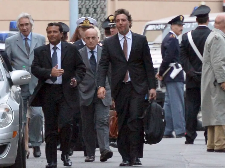 The captain (L) of the "Costa Concordia" Francesco Schettino leaves, after hearings at a Grosseto court, to work out the details of the tragic night of the "Costa Concordia" disaster on Oct. 15, 2012. (Alberto Pizzoli/AFP/Getty Images)