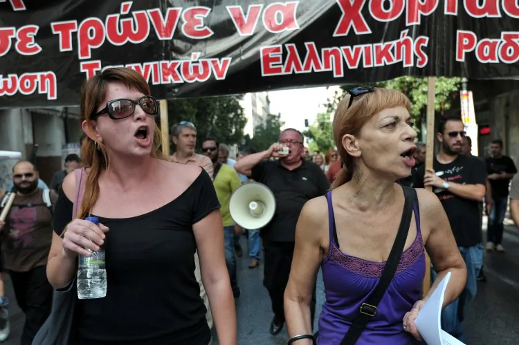 Journalists shout as they march in central Athens during a 24-hour strike on Oct. 17. (Louisa Gouliamaki/AFP/Getty Images)