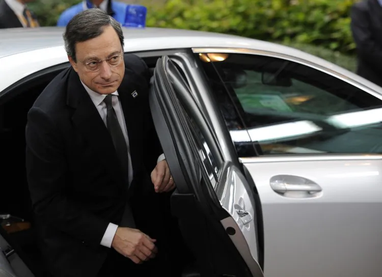 European Central Bank President Mario Draghi (L) arrives for an EU summit in Brussels last Thursday, Oct. 18. It was the first of three summits before Christmas, which EU leaders hope would strengthen the bloc's foundations. (John Tthys/AFP/Getty Images)