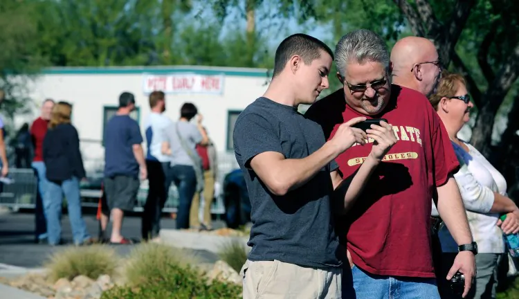 Voters line up during the first day of early voting in Nevada at the Centennial Center polling station on Oct. 20 in Las Vegas, Nev. Some poll workers are confused, as are some voters, by new and fluctuating state voting rules. (David Becker/Getty Images)