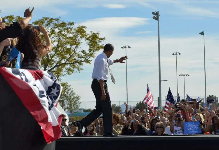 U.S. President Barack Obama waves at supporters during a campaign rally in Las Vegas, Nev., on Nov. 1. Obama returned to campaigning after several days spent assessing the damage left by Hurricane Sandy. (Jewel Samad/AFP/Getty Images)