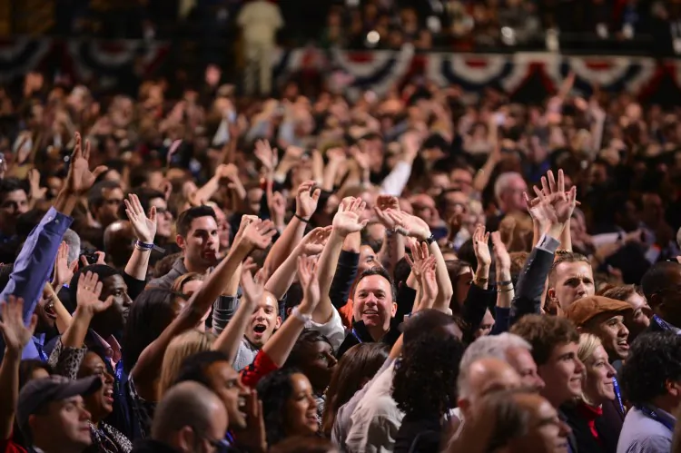 Supporters of U.S. President Barack Obama cheer at his second term victory in Chicago on Nov. 6, 2012. According to a recent survey, Democrats and Republicans see two very different worlds. (Robyn Beck/AFP/Getty Images)