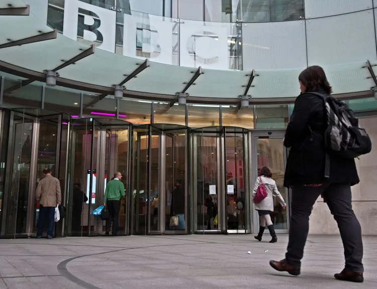 BBC employees arrive for work at the organization's New Broadcasting House in central London, on November 12, 2012. (Will Oliver/AFP/Getty Images)