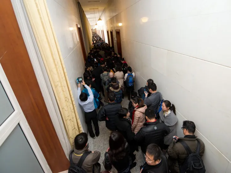 Journalists queue as they wait to be allowed access to the main hall inside the Great Hall of the People during the closing ceremony of the Communist Party Congress in Beijing on Nov. 14, 2012, the last day of the conference. They were finally only admitted for the last moments of the conference. (Ed Jones/AFP/Getty Images)