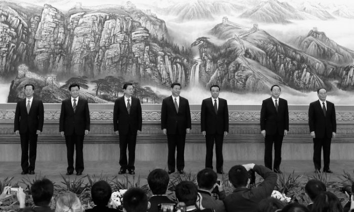 (L-R) Zhang Gaoli, Liu Yunshan, Zhang Dejiang, Xi Jinping, Li Keqiang, Yu Zhengsheng and Wang Qishan greet the media at the Great Hall of the People on Nov. 15, 2012 in Beijing. (Lintao Zhang/Getty Images)