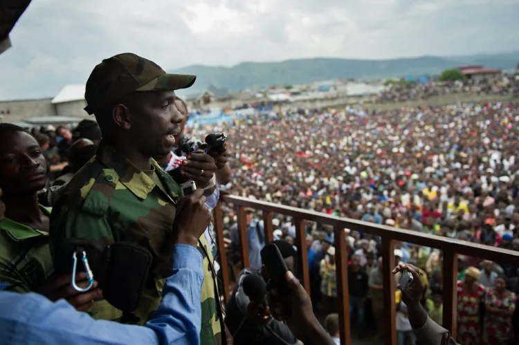 United Nations armoured personnel carriers drive towards a UN base in Monigi, located 3 miles from Goma on Sunday. (Phil Moore/AFP/Getty Images)
