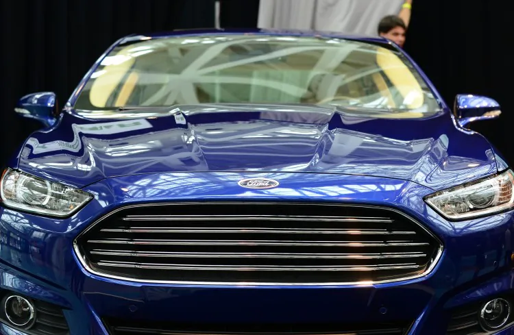 A 2013 Ford Fusion is seen at the LA Auto Show on Nov. 29, 2012 in Los Angeles, California. Due to increased popularity of its vehicles, Ford plans to hire an additional 2,200 new salaried employees. (Frederick J. Brown/AFP/Getty Images)
