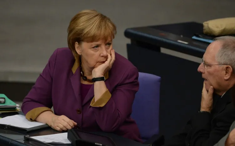 German Chancellor Angela Merkel (L) talks with German Finance Minister Wolfgang Schaeuble during a session at the Bundestag on Nov. 30, 2012 in Berlin. (By Johannes Eisele/AFP/Getty Images)