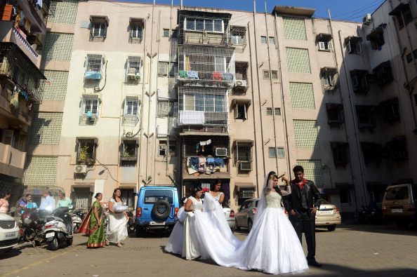 Bride Emilia D'Silva leaves home for her marriage ceremony at the Mount Mary church in Mumbai, India, on Dec. 12, 2012. (Indranil Mukherjee/AFP/Getty Images)