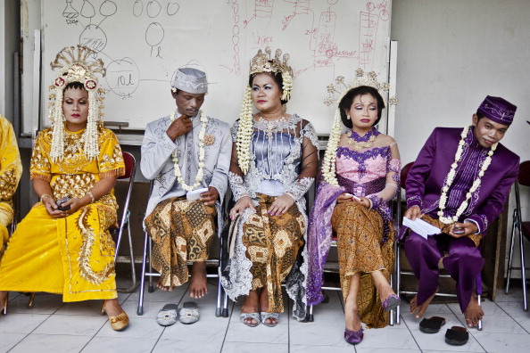 Bride and groom couples prepare for marriage during a mass wedding ceremony on Dec. 12, 2012 in Yogyakarta, Indonesia. (Ulet Ifansasti/Getty Images)