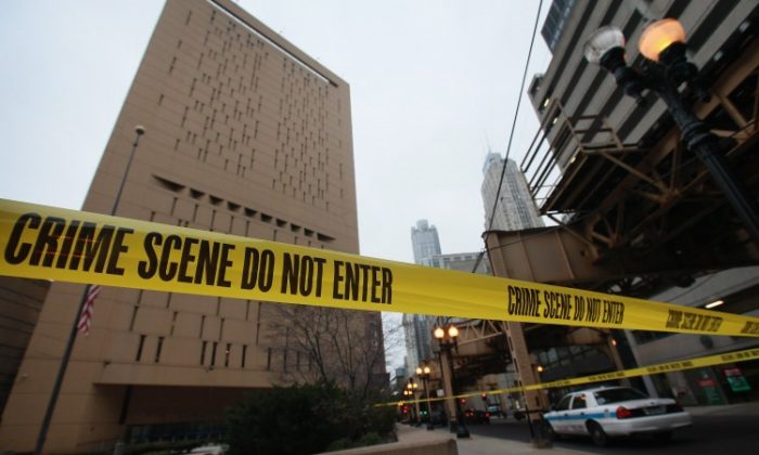 Crime scene tape surrounds the federal Metropolitan Correctional Center in the Loop after two convicted bank robbers escaped on Dec. 18, 2012 in Chicago, Illinois. (Scott Olson/Getty Images)