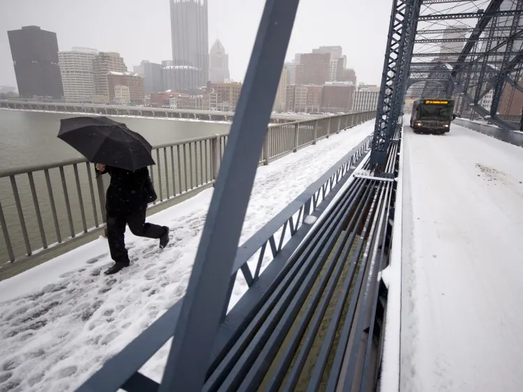 Residents shovel snow on Mt. Washington after a winter storm blanketed the Midwest with snow, Dec. 26, in Pittsburgh, Pa. (Jeff Swensen/Getty Images)