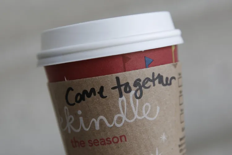 A cup of coffee with the words "come together" at the Union Station Starbucks on Dec. 27, 2012, in Washington, D.C. Starbucks CEO Howard Schultz said that the words are meant for lawmakers, referring to the divisive negotiations over the "fiscal cliff." (Drew Angerer/Getty Images)