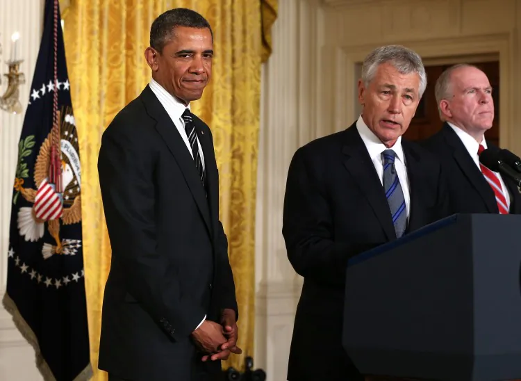 Former U.S. Sen. Chuck Hagel (R-Neb.) (2nd L), U.S. President Barack Obama (L), and Deputy National Security Advisor John Brennan (R) in the East Room at the White House on Jan. 7, 2013, in Washington, D.C. President Obama has nominated Hagel for the next secretary of defense and Brennan for the new director of the CIA. (Alex Wong/Getty Images)