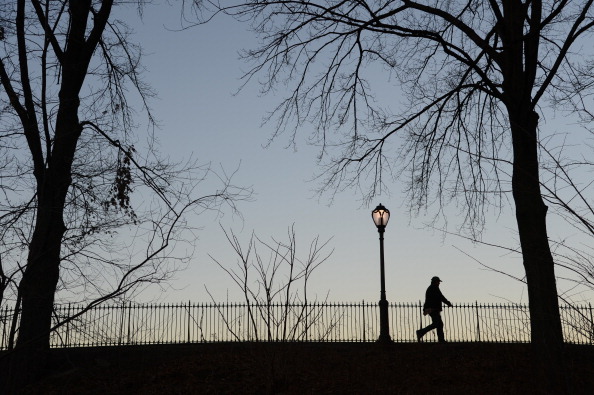 A man walks along the Reservoir after sunset on Jan. 7, 2013 in New York's Central Park. (Stan Honda/AFP/Getty Images)