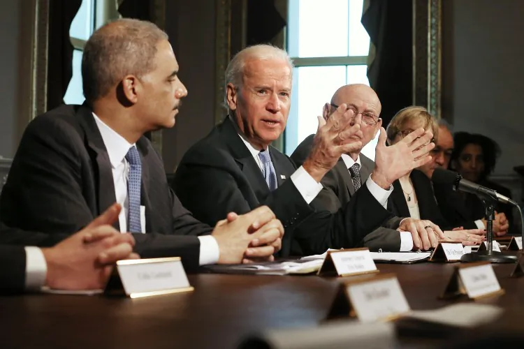 Vice President Joe Biden (2nd L) and U.S. Attorney General Eric Holder (L) meet with survivors of gun violence and gun-safety advocacy groups, Jan. 9 in Washington, D.C. Biden announced that executive action might be taken to curb gun violence. (Chip Somodevilla/Getty Images)