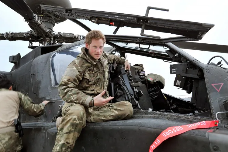 Prince Harry makes his early morning pre-flight checks on the flight-line at Camp Bastion in southern Afghanistan. (John Stillwell - WPA Pool/Getty Images)