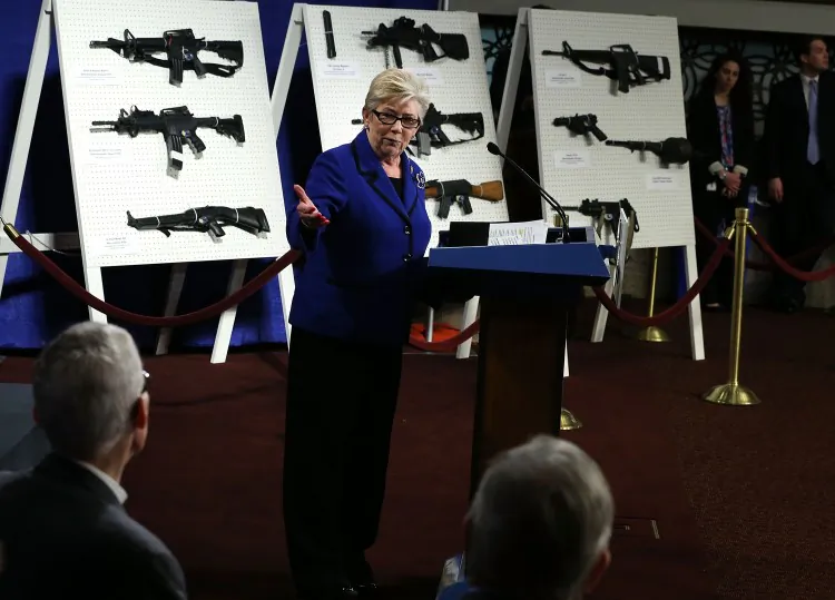 U.S. Representative Carolyn McCarthy (D-N.Y.) speaks next to a display of assault weapons during a news conference Jan. 24, 2013, on Capitol Hill in Washington, D.C. Led by Sen. Dianne Feinstein (D-Calif.), the 2013 Senate proposed a new ban on military-style assault weapons. (Alex Wong/Getty Images)